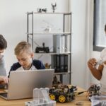 father-sons-making-robot